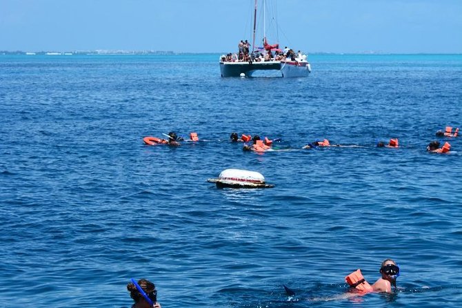 Amazing tour to the beauty Isla Mujeres with Snorkel and open bar - The Extra Cost: Isla Mujeres Dock Fee and Optional Golf Carts