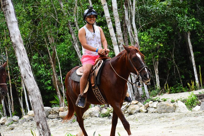 ATV (shared), Horse Back Riding, Ziplines, & Cenote from Cancún - Cenote time: mineral water and a semi-open cave scene