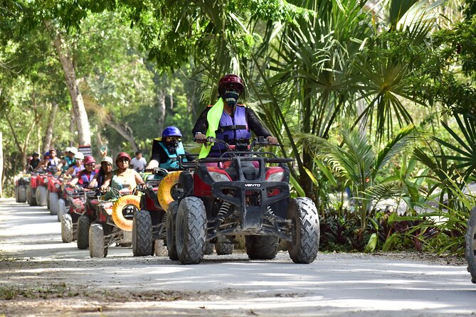 ATV Tour Zipline and Explore 2 Hidden Cenotes - Stop 1 at Cenotes Kin-Ha: Sun Rays, Deep Blue Water, and Park Zip Lines
