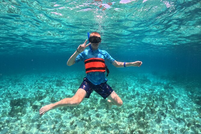 Cancún Catamaran to Isla Mujeres + Snorkel, Open Bar & Lunch - Snorkeling Stop: Gear Included, Group Swim Style