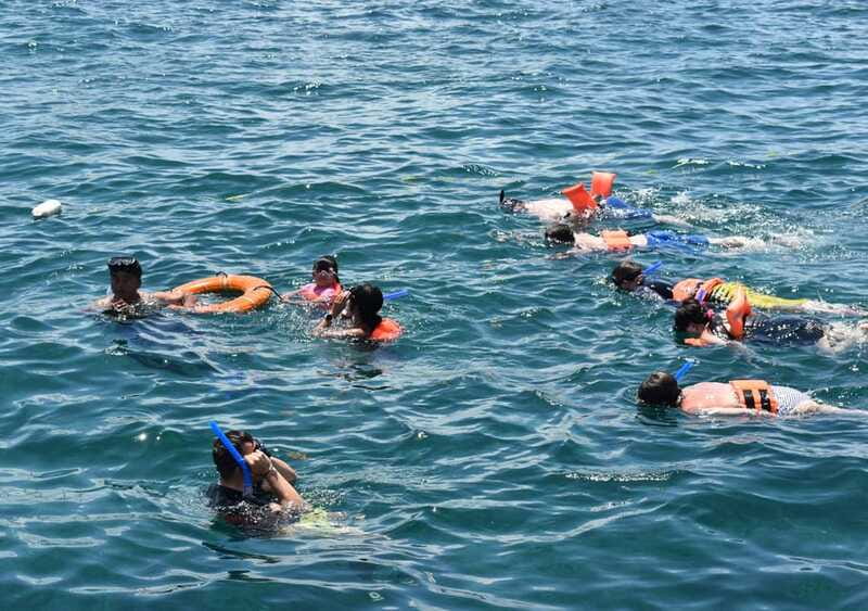 Cancun: Isla Mujeres Only Adults Catamaran, drinks & snorkel - Guides and crew: energy matters on a day like this