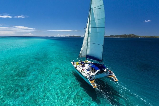 Catamaran adventure to Isla Mujeres with Snorkel,Buffet,Open Bar and Beach Club - Snorkeling and Spinnaker: Water Fun, Photo Ops, and Realistic Limits
