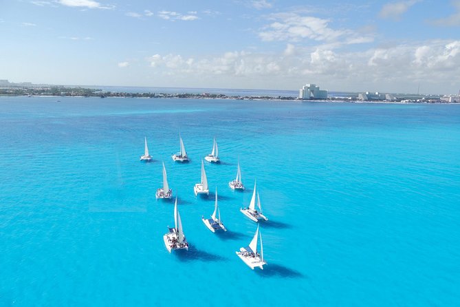 Catamaran Isla Mujeres Tour with Hotel Pick Up included - At Sea Between Cancun and Isla Mujeres: Gear, Crew, and a Loud Music Check