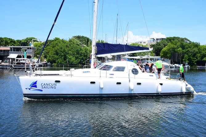Catamaran Tour to Isla Mujeres, Open bar, Lunch, Snorkeling, Beach Club Included - Beach club access and lunch: setting realistic food expectations