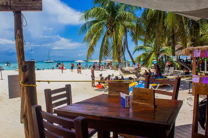 Discover Isla Mujeres: Catamaran, Snorkeling, and "Ice Bar" - Spinnaker Flying on the Water (Weather Permitting)