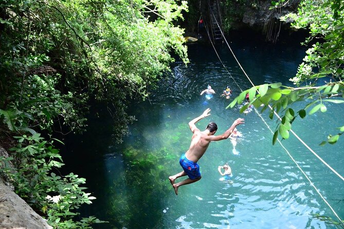 Experience ATV (shared) Ziplines & Cenote with Lunch from Cancún - Zip-Line Time: Flying Over the Jungle on Provided Gear
