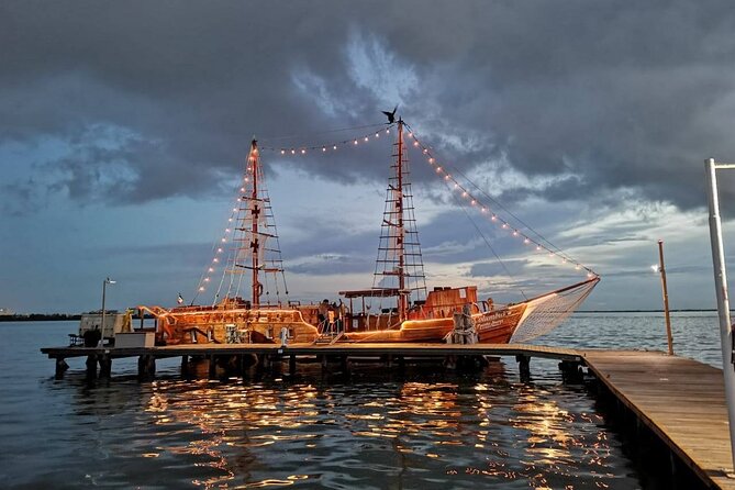 Feel the love on a romantic dinner at Cancun sea, with live music and open bar. - The 3-Course Dinner on Board: Steak, Lobster, and the Pleasant Surprise Factor