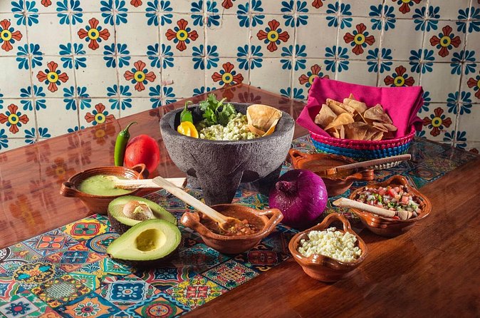 Flavors of Mexico: Cancun Cooking Class & Market Visit - Restaurant setting: cooking in a long-running Cancun spot