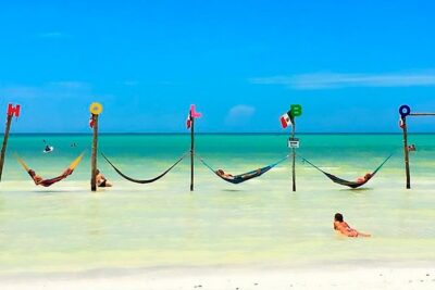 Holbox plus Island Magic by boat Tour from Cancun - Yalahau Lagoon cenote swim: cool off before the islands