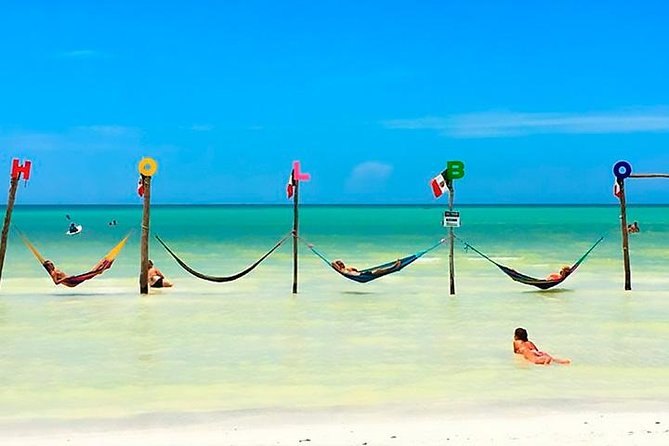 Holbox plus Island Magic by boat Tour from Cancun - Yalahau Lagoon cenote swim: cool off before the islands