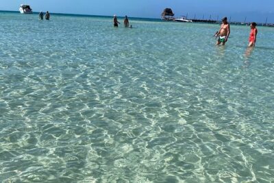 Isla Mujeres Basic Tour in Catamaran with Snorkel and Open Bar - Check-in snacks, lockers, and a smooth 10 am departure