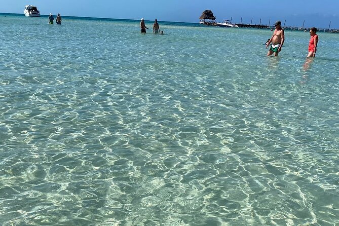 Isla Mujeres Basic Tour in Catamaran with Snorkel and Open Bar - Check-in snacks, lockers, and a smooth 10 am departure