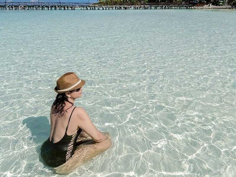 Isla Mujeres Catamaran Tour: Snorkel & Beach Adventure - Snorkeling El Meco Reef and Underwater Statues: The Main Event