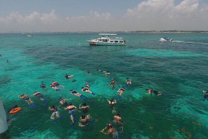 Isla Mujeres Full Day Tour on Yacht with Snorkel and Buffet - Open Bar, Crew Energy, and the Return with Music and Sunset