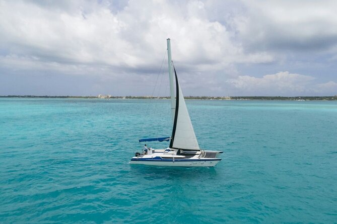 Isla Mujeres Premium Tour in Catamaran with Snorkel and Buffet - Playa Norte on Isla Mujeres: Swim, Stroll, and Grab Snacks