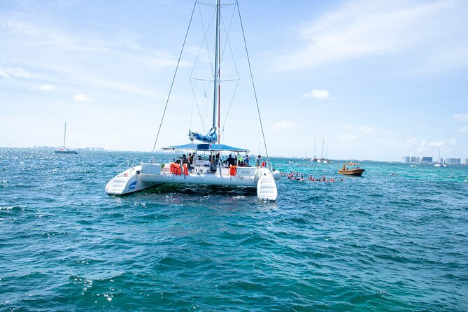 Isla Mujeres Tour on Catamaran with Snorkel, Open Bar, Buffet & Beach club - Snorkeling at El Meco Reef: Real Time in the Water