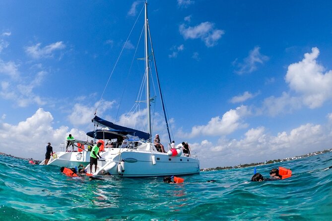 Isla Mujeres Tour on Catamaran with Snorkel, Open Bar, Buffet & Beach club - Isla Mujeres Free Time: Murals, Streets, and Island Pace