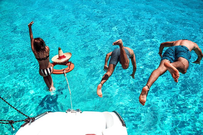 Isla Mujeres Tour on Catamaran with Snorkel, Open Bar, Buffet & Beach club - Beach Club Time: Buffet, Open Bar, and Shade Reality