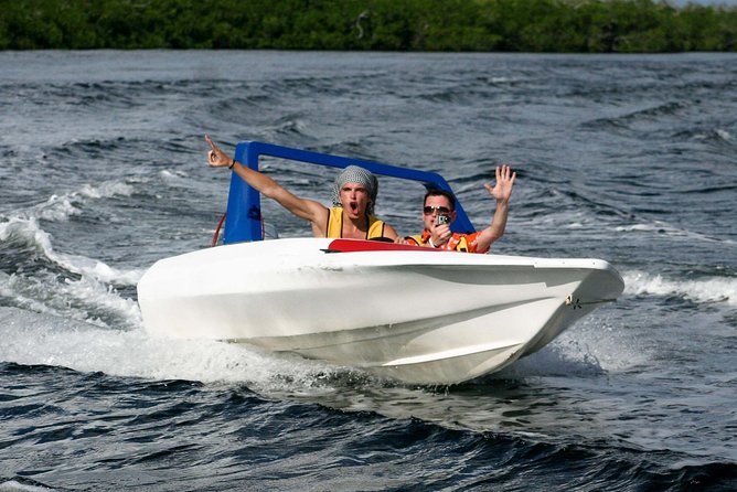 Jungle Tour In Cancun, drive a speedboat through the lagoon with your companion - Mangroves Stop for About 45 Minutes: what you’re actually doing there