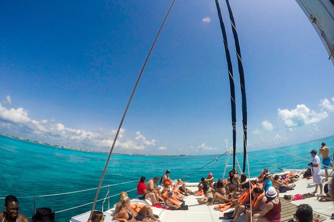 Mujeres Island Tour by Catamaran from Cancun City - Stop 1: Playa Tortugas snorkel time, gear, and open bar vibes