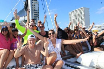 Top Isla Mujeres Catamaran Tour with Snorkel Open Bar and Buffet lunch - Sailing to Isla Mujeres: snacks, music, and the open-bar rhythm